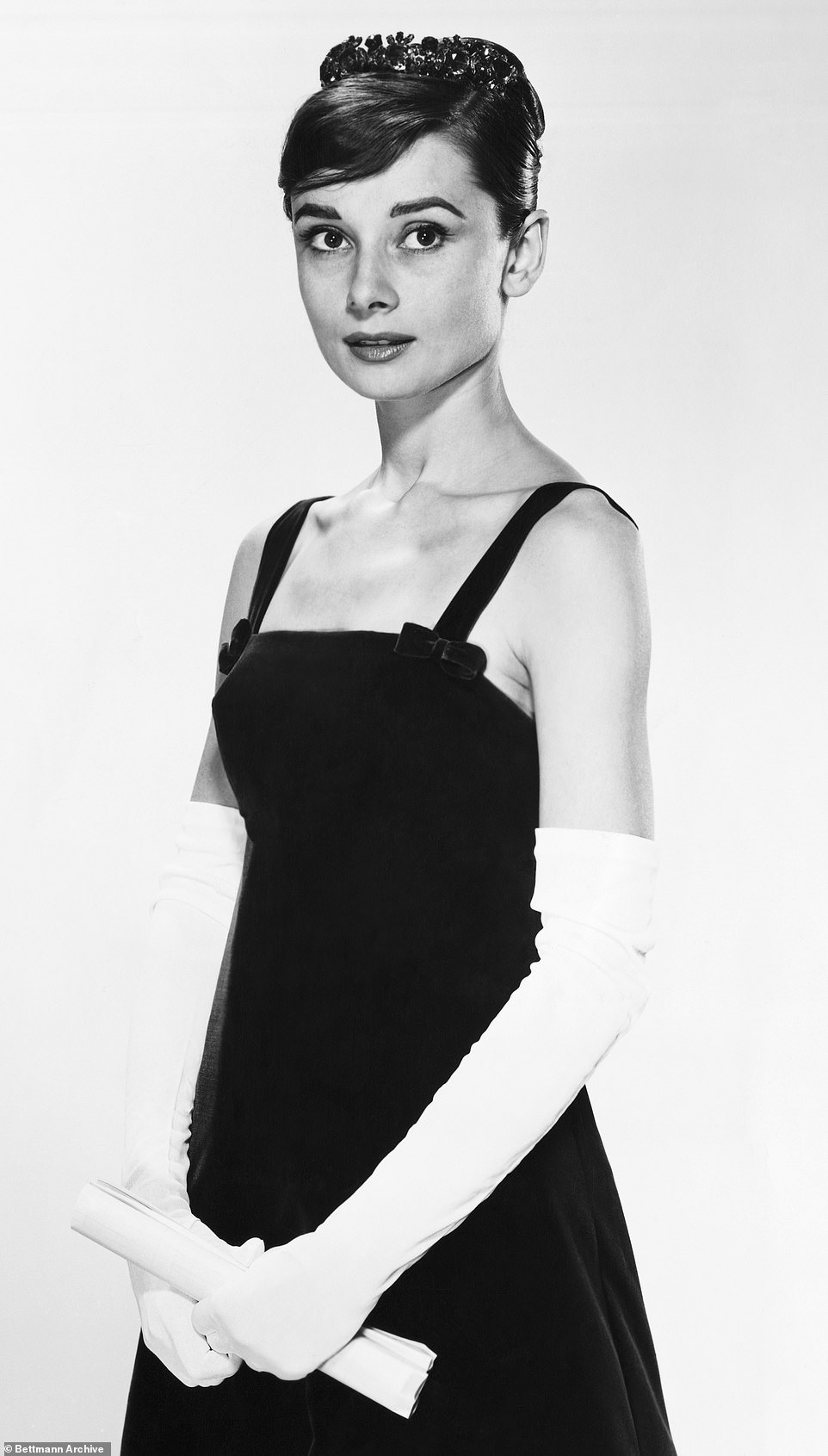 Audrey Hepburn (undated photo) exuded old Hollywood glamor with her understated style that accentuated her petite frame.  She is pictured here wearing white gloves.