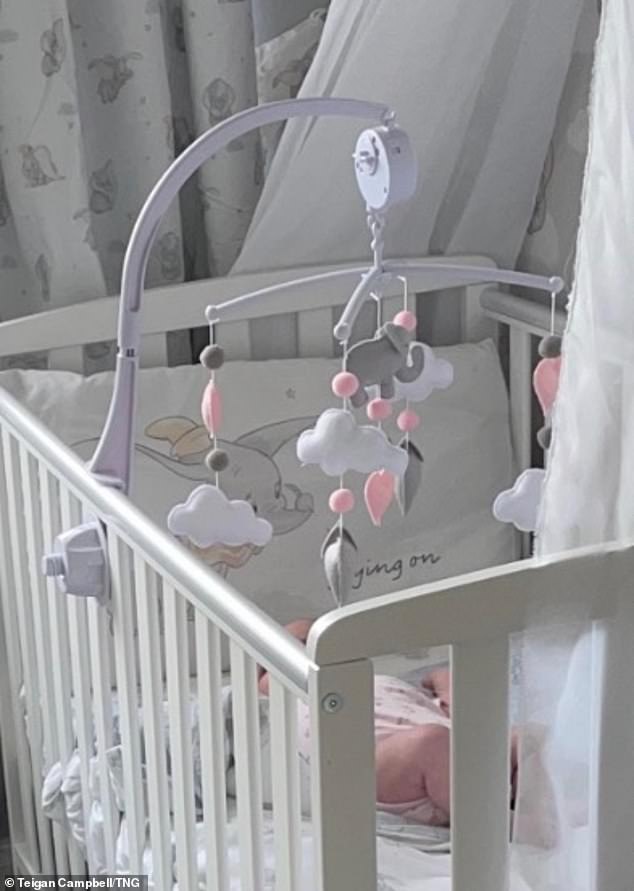 Nine-month-old Poppy, pictured in her crib, was left with a visible mark and her mother said she would not have been surprised if the baby had lost her finger.