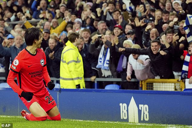 Mitoma's knee slides in front of Brighton fans after scoring the first goal of the game