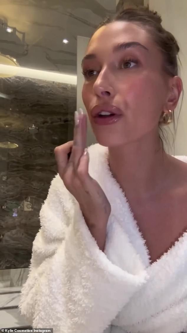 That's why you shine, girl: Stephen Baldwin's daughter wore a white robe while touching her face