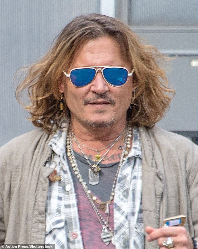 Vindicated: A jury found Heard's claims, which were published in a 2018 Washington Post op-ed, against Depp to be defamatory and the actor was ordered to pay $15 million in damages;  Depp seen in July