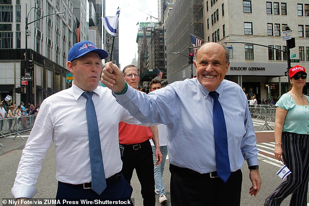 Former New York Mayor Rudy Guiliani (right) also donated $1,000 to Hamlin's toy drive on Tuesday.