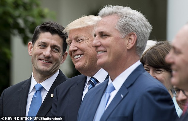 HAPPIER TIMES: Then President Donald Trump (center) and House Majority Leader Kevin McCarthy (right) celebrate House Republicans rolling back Obamacare in May 2017. The Senate never did the same itself, so the bill was never fully passed.