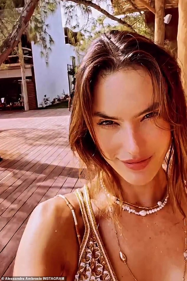 Close up: The perfect model included videos of herself enjoying resort accommodations while wearing necklaces and a knit top