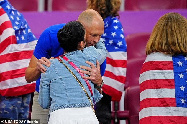 Berhalter and his wife embrace after the United States were knocked out of the World Cup on December 3.