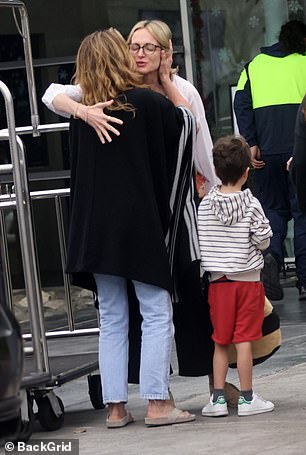 So long: Aniston was later seen saying goodbye to Kimmel's wife while their young son was nearby