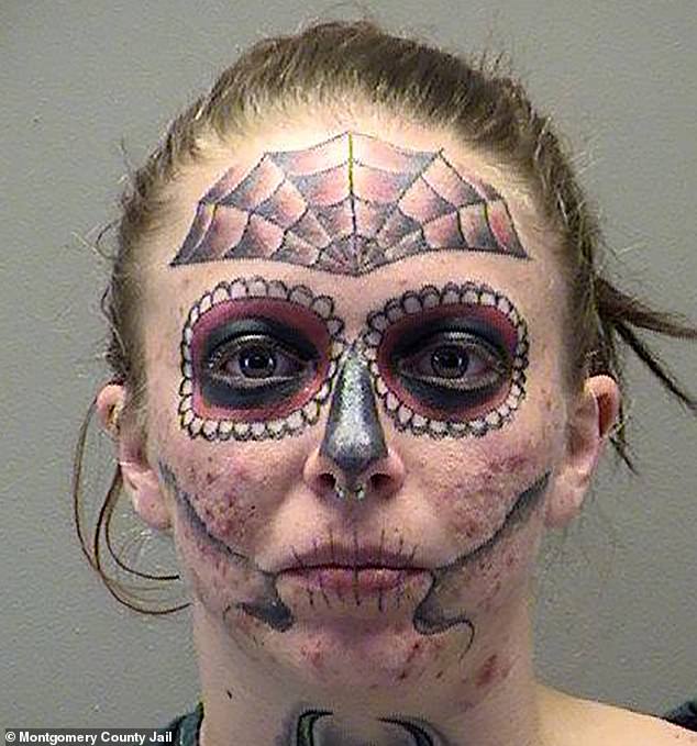 Her photo featured numerous face tattoos, including a skull design around her eyes, a spider web across her forehead, and more skeleton-inspired drawings around her cheeks, nose, and lips.