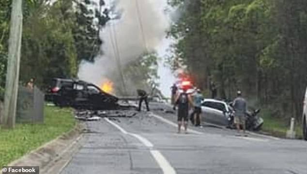 Police allege that Taufua swerved into the wrong lane on Bonogin and collided with a car carrying three (pictured, aftermath of the accident)