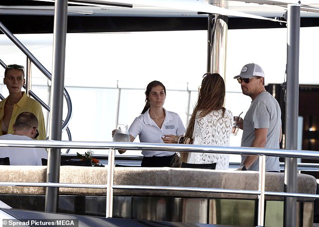 Group: The friends chatted with a crew member on board the ship.