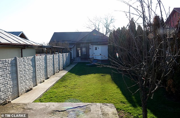 The two-bedroom bungalow, located in Bucharest's Tuhari district on the city's northern outskirts, is where Tate's glamorous girlfriend Georgiana Naghel, 28, lives, along with her housekeeper and two dogs, a pitbull and an alsatian.