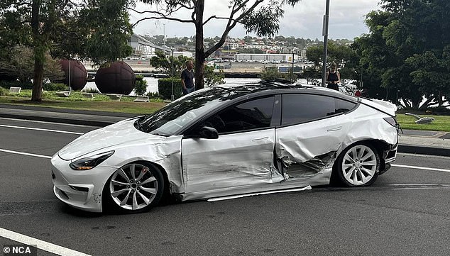 The images are a side view showing the extent of the damage to the Tesla that crashed on Wednesday.