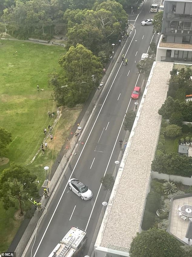 Pictured is an aerial view of the scene after a Tesla crashed on a downtown street.