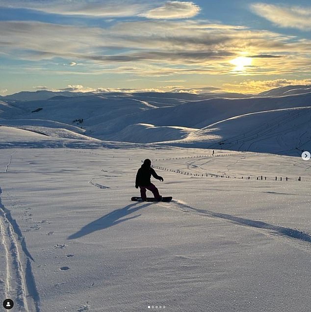 A snowboarder on the fresh snow in the Scottish Highlands