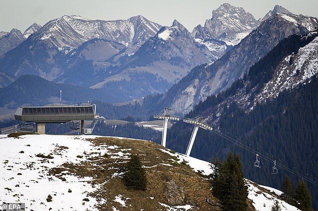 VILLARS-SUR-OLLON, SWITZERLAND: The chairlift of 'Le petit chamossaire' sits closed due to the lack of snow in an alpine resort on December 31