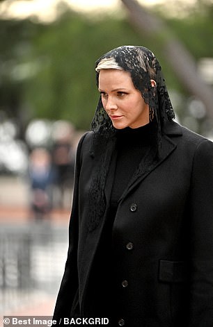 The royal mother of two bowed her head briefly as she walked towards the cathedral ahead of today's event.