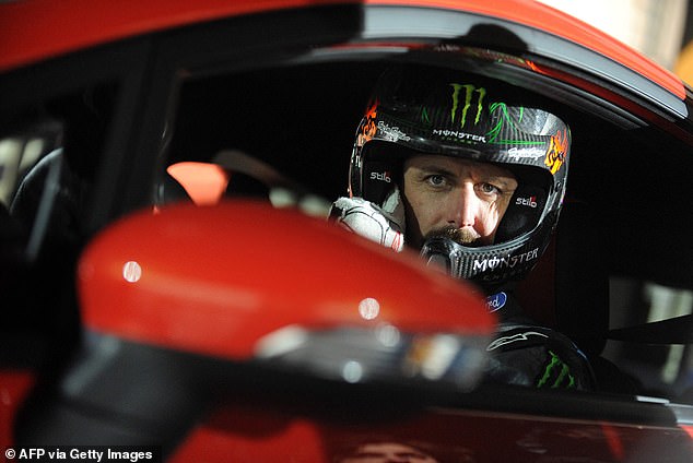 Ken Block, 55, died after his snowmobile flipped over and fell on him in Utah on Monday afternoon.  Pictured: Block poses for a photo in a Ford Fiesta ST in Budapest, Hungary, March 2013.