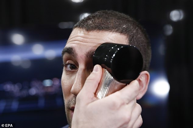 Pictured: A man testing out the smart brow applicator at the Consumer Electronics Show