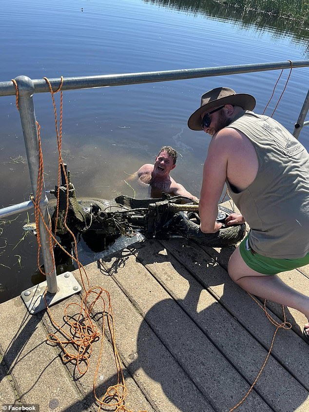 Mr Rushworth even jumped into the murky water after the magnet got stuck while they were retrieving the heavy scooter from the wetlands (pictured)