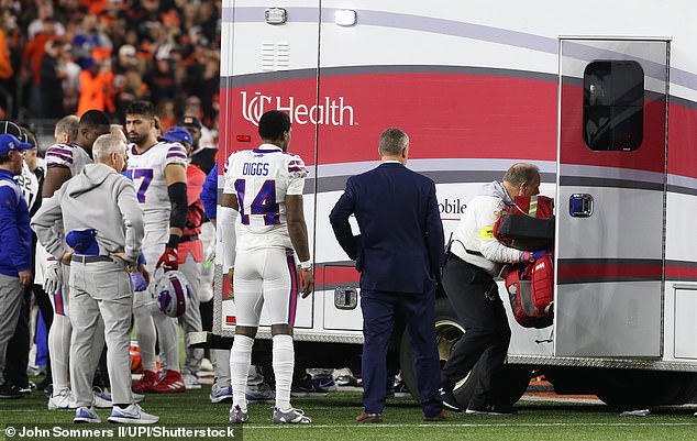 Bills players surround teammate Damar Hamlin (3) after his heart attack on Monday