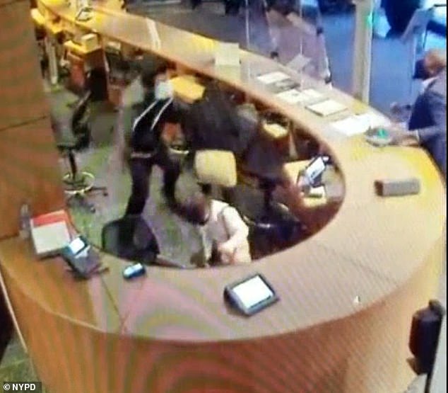 Cabana is shown climbing onto the desk with a knife in hand and approaching the two workers.  Authorities say the attack came just a day after his museum pass was revoked.