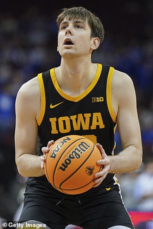 Patrick McCaffery #22 of the Iowa Hawkeyes shoots a free throw against the Seton Hall Pirates at the Prudential Center on November 16