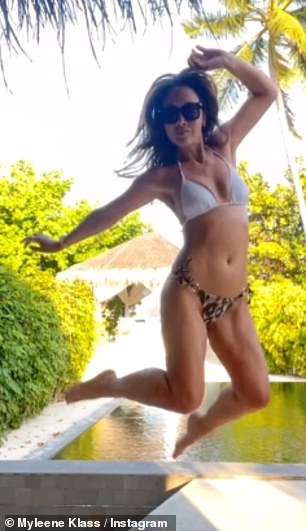 Playful: The former Hear'Say star, 44, took to Instagram on Wednesday to share a fun-filled video of herself jumping into the air in her bikini