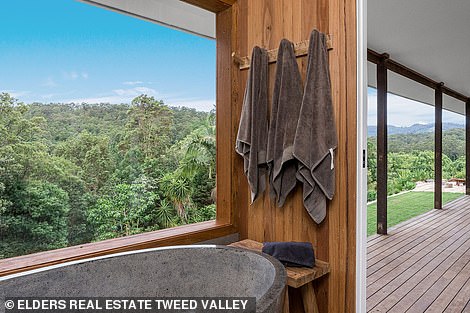 Reclaimed wood, stone elements, neutral tones, natural textures, and rattan pendant lamps give the main house a calm, earthy feel, while the expansive sundeck and plunge pools add a touch of luxury