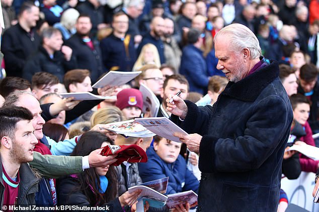 Co-Chairman signs fan shows at the Mark Noble Testimonial Match in 2016