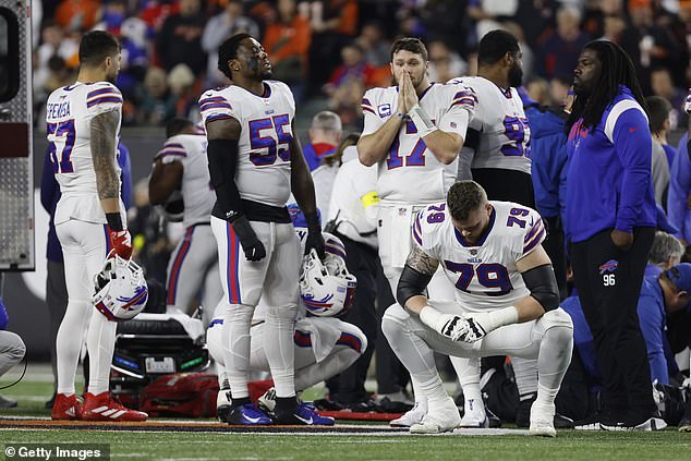 Buffalo Bills players react after teammate Damar Hamlin #3 was injured against the Cincinnati Bengals during the first quarter at Paycor Stadium on Monday.