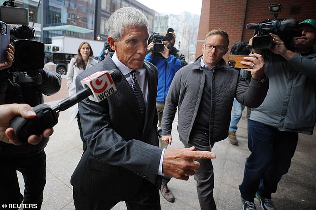 The singer ignored reporters as he entered court in Boston on Wednesday to be sentenced.