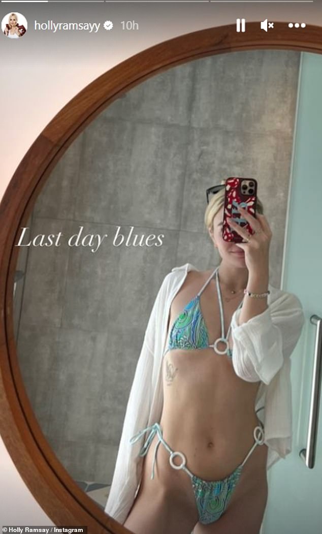 'Last Day of Sadness': Just a few days earlier, Holly had taken to her social media to pose in a skimpy blue halter-neck bikini, before donning a strapless mini-dress for a night out