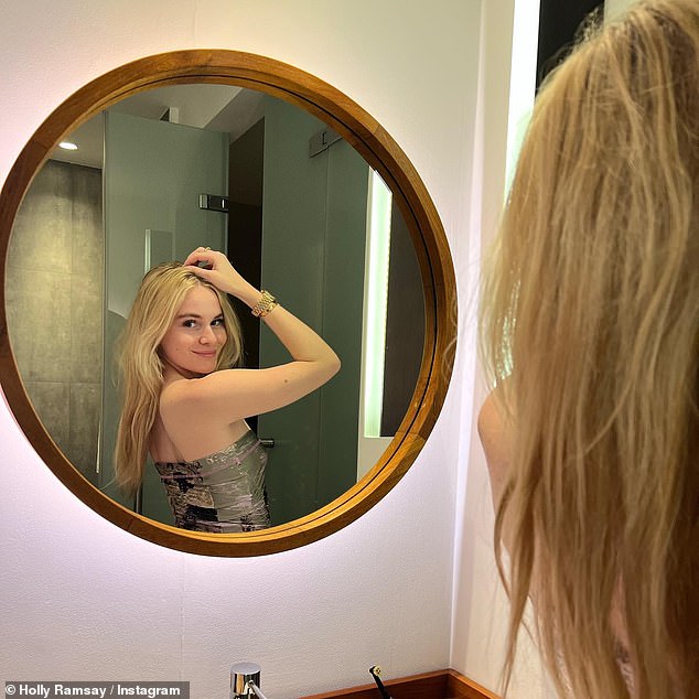 Getting her glam: Showed off her svelte physique in the halter-neck swimsuit before donning a strapless mini-dress for a night out