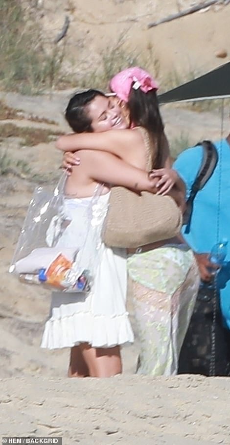 Hugs: Gomez was seen sharing a warm hug with Nicola at one point, as they enjoyed their time at the beach with friends