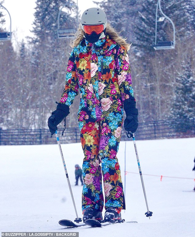 Jumping down the mountain: Klum was a must in her eye-catching ski suit as she conquered the mountain.  His entire look was covered in a collage of vibrant flowers and he wore his iconic blonde hair loose in straight waves.