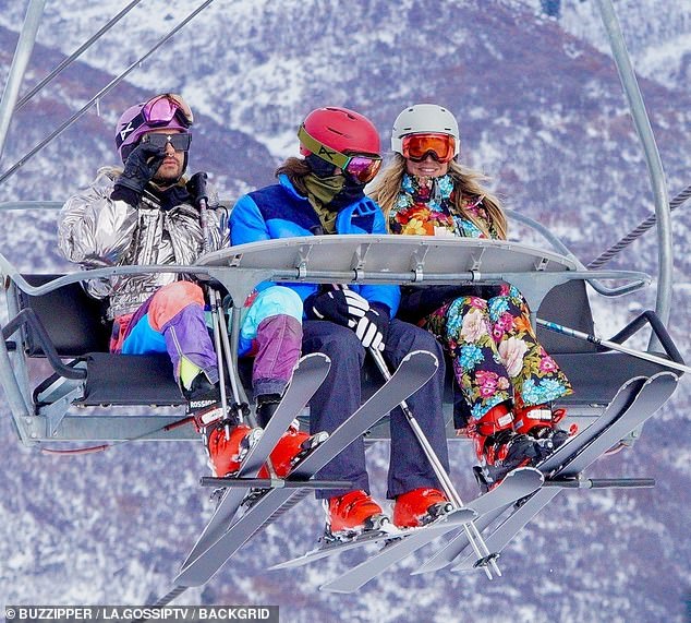 Burst of color: Heidi's rock star husband Tom kept it simple in a neon blue puffer jacket and gray ski pants, but her bandmate brother Bill wore patchwork ski pants, a metallic jacket and a purple helmet.  The twins are founding members of the German pop rock band Tokyo Hotel.