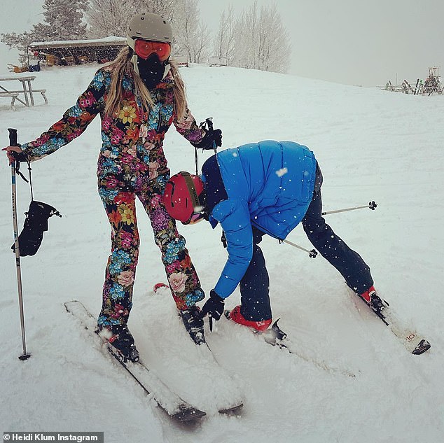 A helping hand: The supermodel couldn't be missing in her striking ski suit as she conquered the mountain with her husband Tom Kaulitz and brother-in-law.