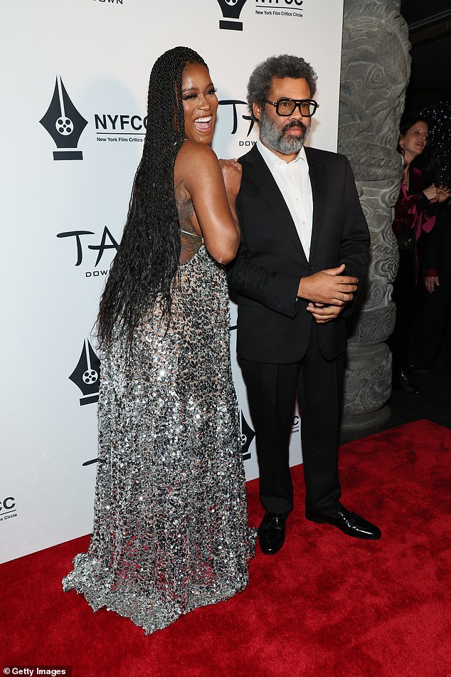 Hilarious: Peele accessorized with a pair of black-rimmed reading glasses and black dress shoes.  The duo were seen laughing as they posed together.