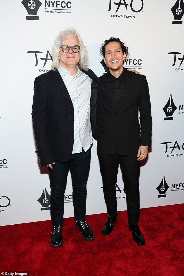 Dapper: Chilean cinematographer Claudio Miranda, 57, and actor Danny Ramírez looked dapper in black suits.