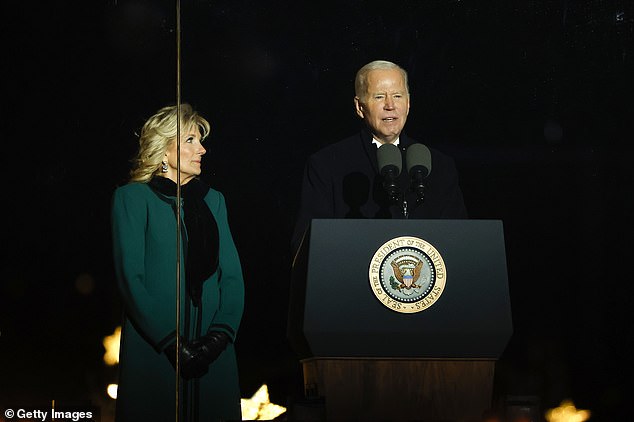 Jill Biden and the rest of the family 'fully support' Joe Biden seeking a second term;  above, the first lady watches the president speak at the lighting of the national Christmas tree in November.