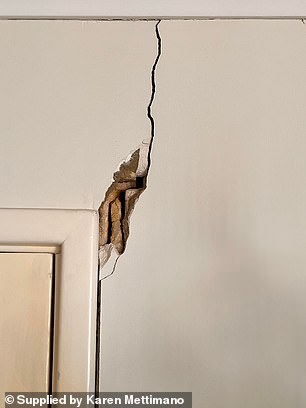 Builders, developers, the council and the Western Australian Planning Commission say they complied with all legal obligations with site inspections and tests (pictured, massive crack in wall of house)