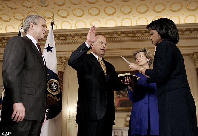 President Bush, left, watches as Secretary of State Condoleezza Rice, right, ceremonially swears in Assistant Secretary of State John Negroponte, second left, at the State Department in Washington in 2007