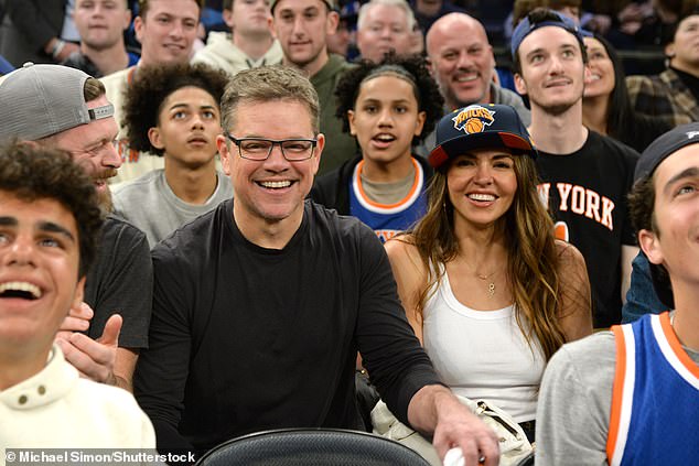 Matt's Look: Damon headed to the game in a black long-sleeved T-shirt and black glasses while sitting next to his wife.