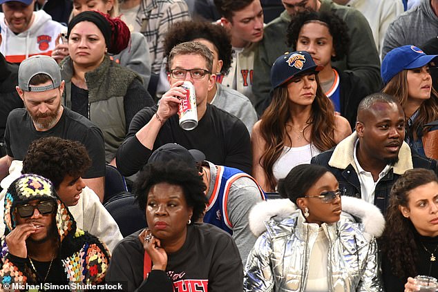 On the court: Damon was also seen drinking a large can of Stella Artois beer during the game, sitting just two rows above Leslie Jones and Ziwe seated on the court.