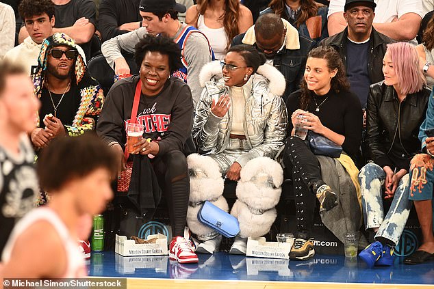 Leslie's look: Leslie Jones was all smiles sitting courtside with Ziwe, dressed in a black Pink Panther sweatshirt and black pants.