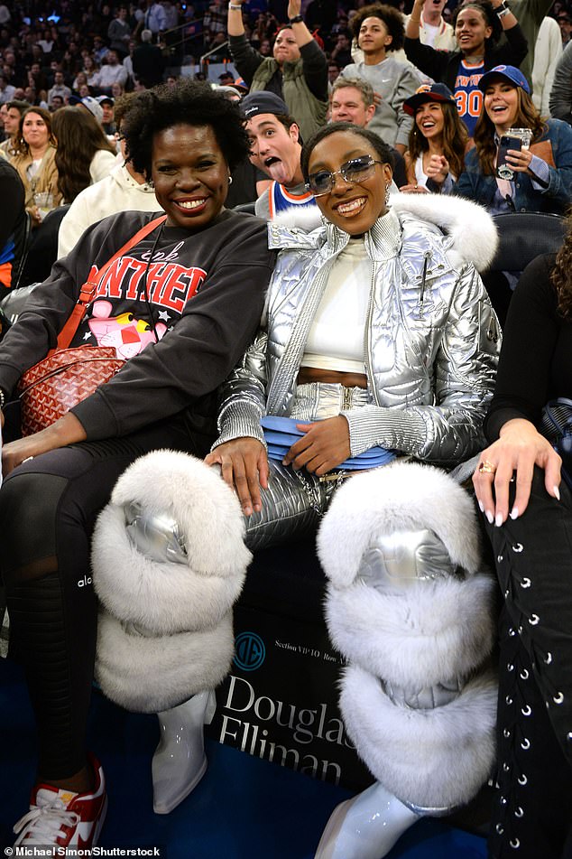 Ziwe Look: Ziwe opted for a white sleeveless top under a silver fur lined puffer coat with matching silver fur lined pants and white shoes, accessorizing with silver earrings.