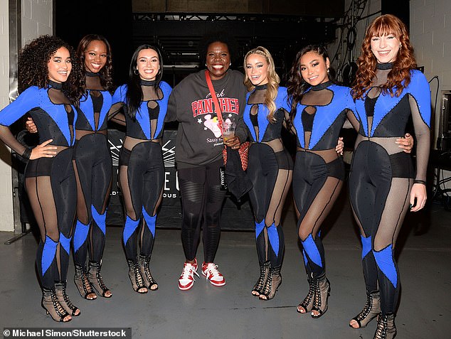 All smiles: Leslie Jones poses with the Knicks City Dancers at the game