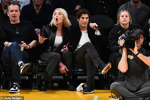 Celebrity sighting: In her first public sighting since the article was published, Maude, 25, sat next to the famous comedian, 55, as they joined other stars in the game.