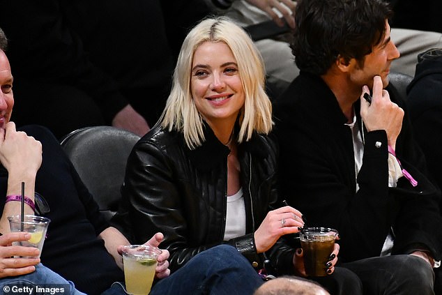 Enjoying the game: Also sitting in the courtside seats was actress Ashley Benson, who went for the rock chic vibes in a leather jacket, white T-shirt and a pair of straight-leg jeans