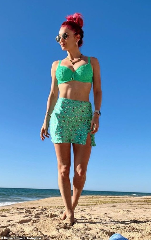 Looking good: The Strictly Come Dancing star showed off her stunning figure in the mint green two-piece as she soaked up the warm Australian weather