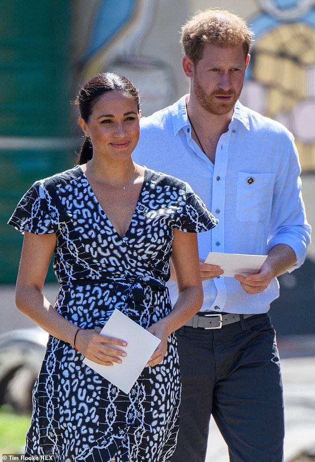 Harry wearing a necklace with Meghan in September 2019 in South Africa